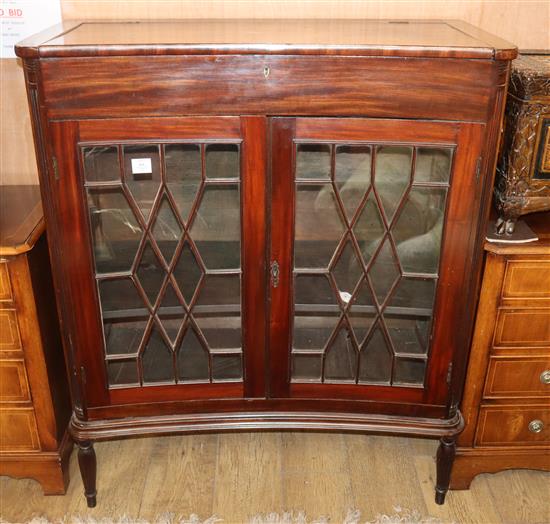 A mahogany concave front display cabinet W.102cm